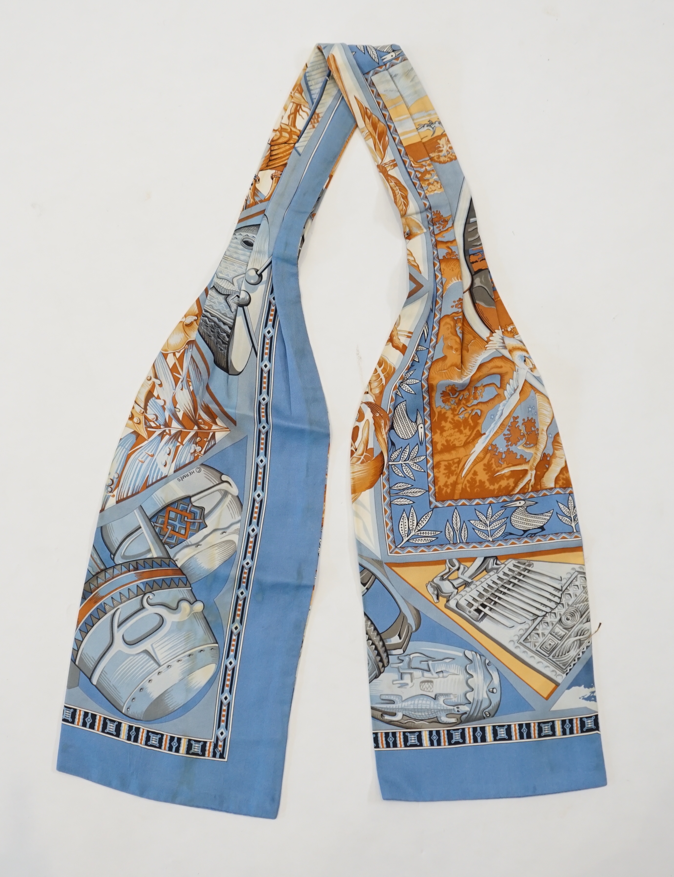 A Hermès silk cravat in ethnographic pattern, length 127cm x 18cm